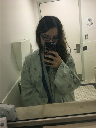 Selina in a hospital gown